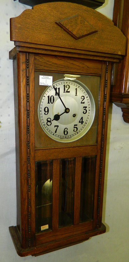 8 day German clock w/ silver painted dial.: Eight day German pendulum clock with silver painted dial. 14" x 31".