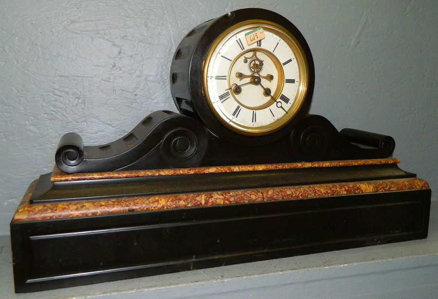 8 day marble clock with outside escapement.: Eight French black and brown marble clock with outside escapement. 13 1/2" x 23 1/2".