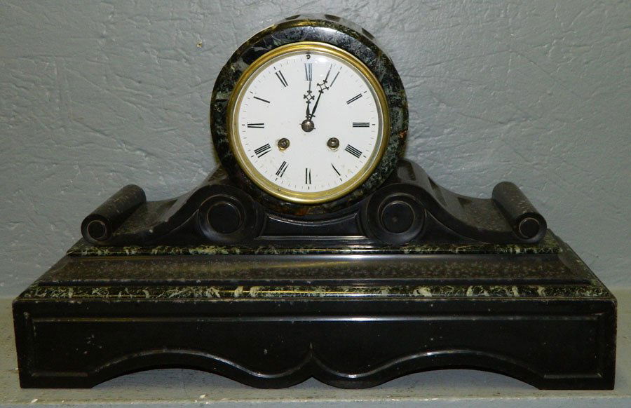 Marble scroll 8 day clock w/Roman numerals.: Black and green marble scroll case eight day clock with Roman numerals. Striking bell is missing. 18" x 11 1/4".