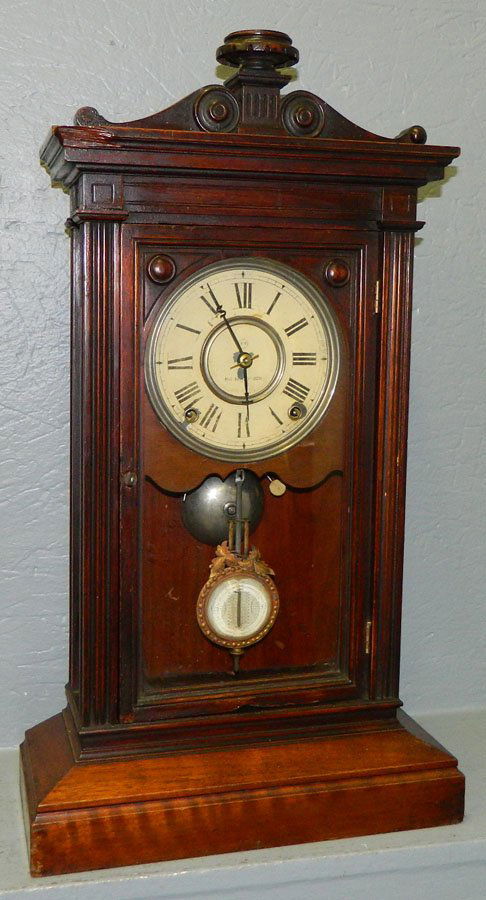 Seth Thomas walnut shelf clock w/torch detail.: Seth Thomas walnut shelf clock with torch detail. 13 1/2" x 24".