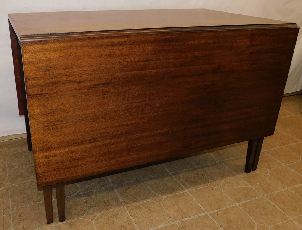 Mahogany Drop Leaf Table: Mahogany Drop Leaf Table. 44" W 26 3/4" D 29 1/4" H "ALL DESCRIPTIONS AND ANY CONDITION STATEMENT GIVEN BY LANGSTON AUCTION GALLERY ARE STRICTLY OPINIONS AND LANGSTON'S SHALL HAVE NO RESPONSIBILITY FO