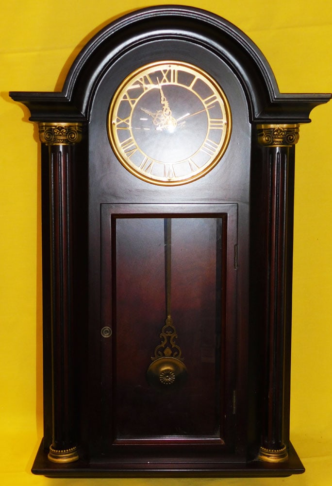 Mahogany Wall Clock: Mahogany Wall Clock. 21" H "ALL DESCRIPTIONS AND ANY CONDITION STATEMENT GIVEN BY LANGSTON AUCTION GALLERY ARE STRICTLY OPINIONS AND LANGSTON'S SHALL HAVE NO RESPONSIBILITY FOR ERRORS OR OMISSIONS. TH