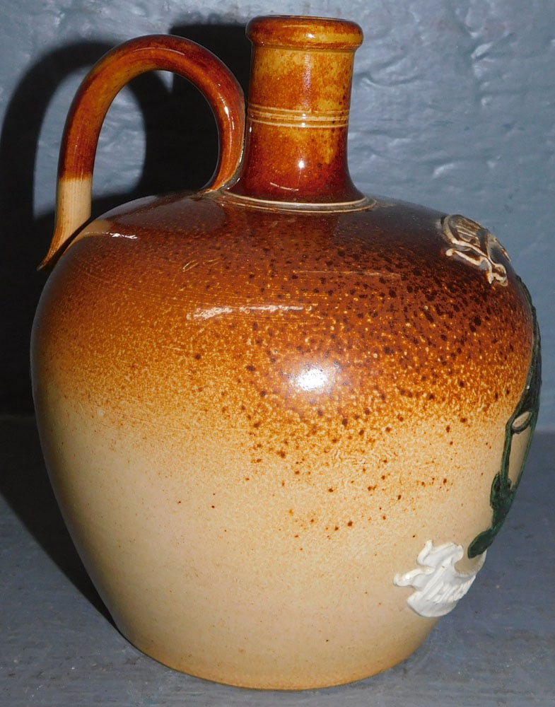 Stoneware Dalton Lambert Whiskey Jug: Stoneware Dalton Lambert Whiskey Jug. 7" H ALL DESCRIPTIONS AND ANY CONDITION STATEMENT GIVEN BY LANGSTON AUCTION GALLERY ARE STRICTLY OPINIONS AND LANGSTON'S SHALL HAVE NO RESPONSIBILITY FOR ERRORS O