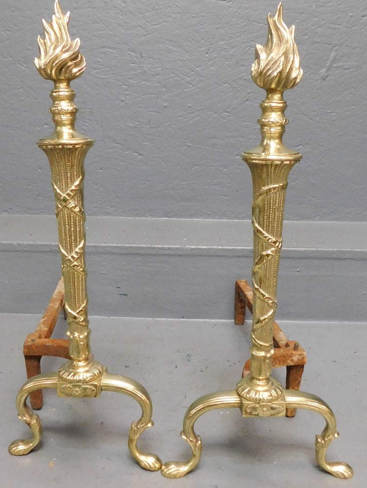 Pair of Brass Torchiere Andirons: Pair of Brass Torchiere Andirons . 20" H ALL DESCRIPTIONS AND ANY CONDITION STATEMENT GIVEN BY LANGSTON AUCTION GALLERY ARE STRICTLY OPINIONS AND LANGSTON'S SHALL HAVE NO RESPONSIBILITY FOR ERRORS OR