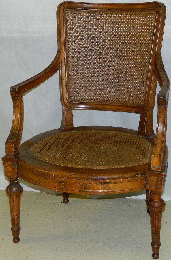 19th c. French caned back and seat arm chair.: 19th century French caned back and seat arm chair.
