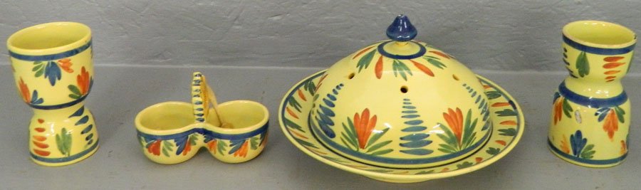 Four pieces of early Quimper yellow ware.: Early Quimper yellow ware cheese dish, salt cellar and 2 egg cups.