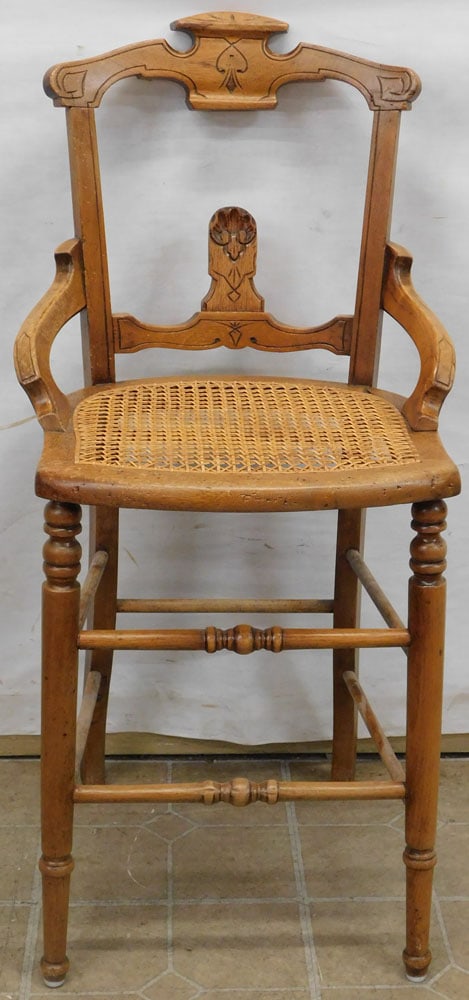 Walnut Victorian Cane Seat High Chair: Walnut Victorian Cane Seat High Chair . 37 3/4" H ALL DESCRIPTIONS AND ANY CONDITION STATEMENT GIVEN BY LANGSTON AUCTION GALLERY ARE STRICTLY OPINIONS AND LANGSTON'S SHALL HAVE NO RESPONSIBILITY FOR E