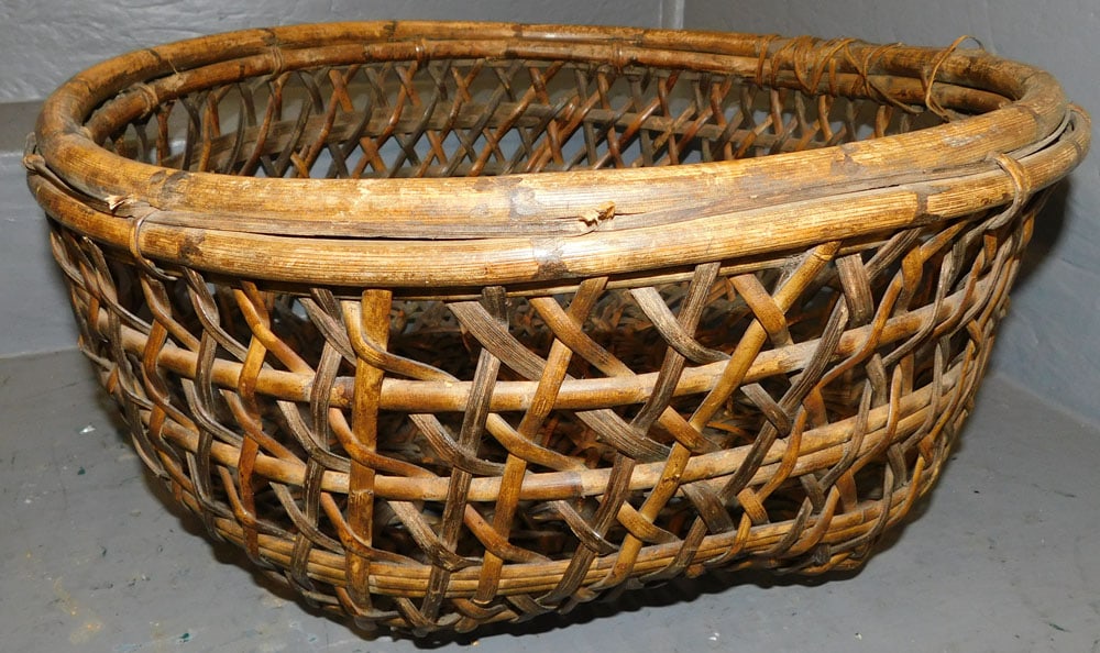 Ratan Basket: Ratan Basket . 20" Dia. 8" H ALL DESCRIPTIONS AND ANY CONDITION STATEMENT GIVEN BY LANGSTON AUCTION GALLERY ARE STRICTLY OPINIONS AND LANGSTON'S SHALL HAVE NO RESPONSIBILITY FOR ERRORS OR OMISSIONS. T