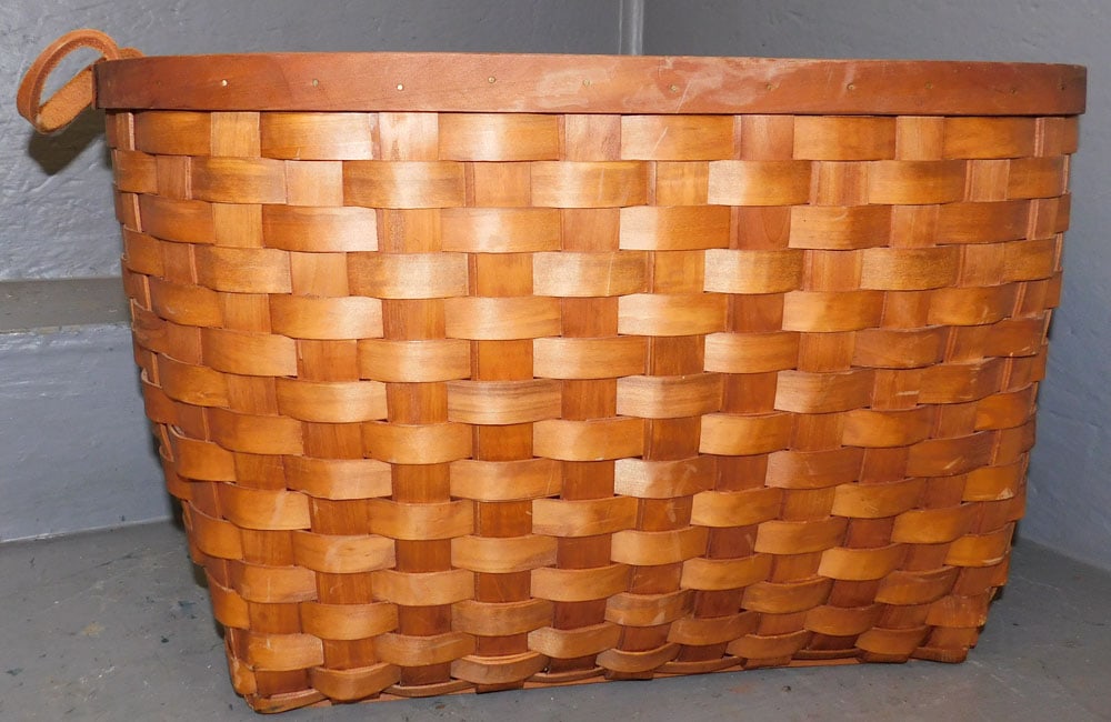 Basket with Leather Handle: Basket with Leather Handle. 22 1/4" W 16 1/2" D 13 1/2" H ALL DESCRIPTIONS AND ANY CONDITION STATEMENT GIVEN BY LANGSTON AUCTION GALLERY ARE STRICTLY OPINIONS AND LANGSTON'S SHALL HAVE NO RESPONSIBILI