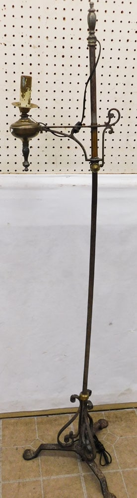 Antique Wrought Iron Floor Lamp: Antique Wrought Iron Floor Lamp. 62" H ALL DESCRIPTIONS AND ANY CONDITION STATEMENT GIVEN BY LANGSTON AUCTION GALLERY ARE STRICTLY OPINIONS AND LANGSTON'S SHALL HAVE NO RESPONSIBILITY FOR ERRORS OR OM