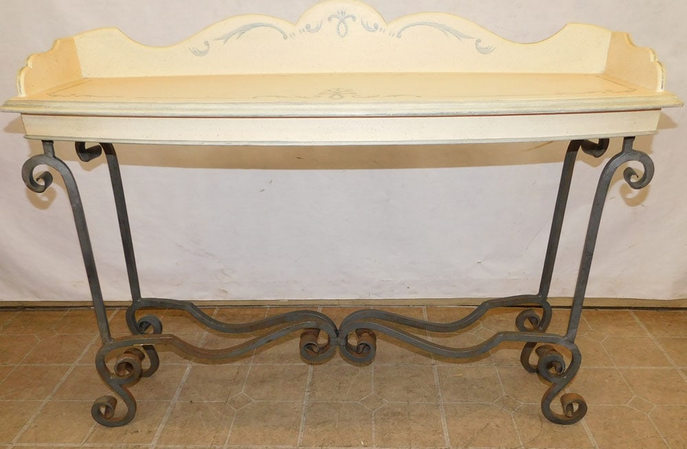 Painted top and wrought iron console: Painted top and wrought iron console. 42" W 13 1/2" D 32 1/4" H ALL DESCRIPTIONS AND ANY CONDITION STATEMENT GIVEN BY LANGSTON AUCTION GALLERY ARE STRICTLY OPINIONS AND LANGSTON'S SHALL HAVE NO RESPON