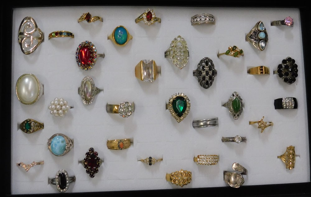 Lot Costume Jewelry Rings In Display Case - Some Marked Sterling .925: Lot of Costume Jewelry. ALL DESCRIPTIONS AND ANY CONDITION STATEMENT GIVEN BY LANGSTON AUCTION GALLERY ARE STRICTLY OPINIONS AND LANGSTON'S SHALL HAVE NO RESPONSIBILITY FOR ERRORS OR OMISSIONS. THE AB