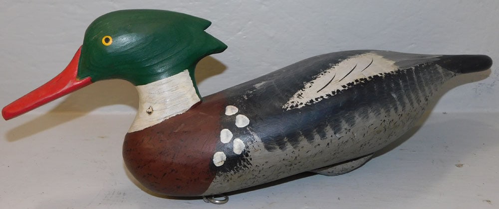 Painted Carved Wood Duck Decoy, (Signed - Dryane): Painted Carved Wood Duck Decoy, (Signed - Dryane). 18 1/4" L 6 1/2" H ALL DESCRIPTIONS AND ANY CONDITION STATEMENT GIVEN BY LANGSTON AUCTION GALLERY ARE STRICTLY OPINIONS AND LANGSTON'S SHALL HAVE NO 