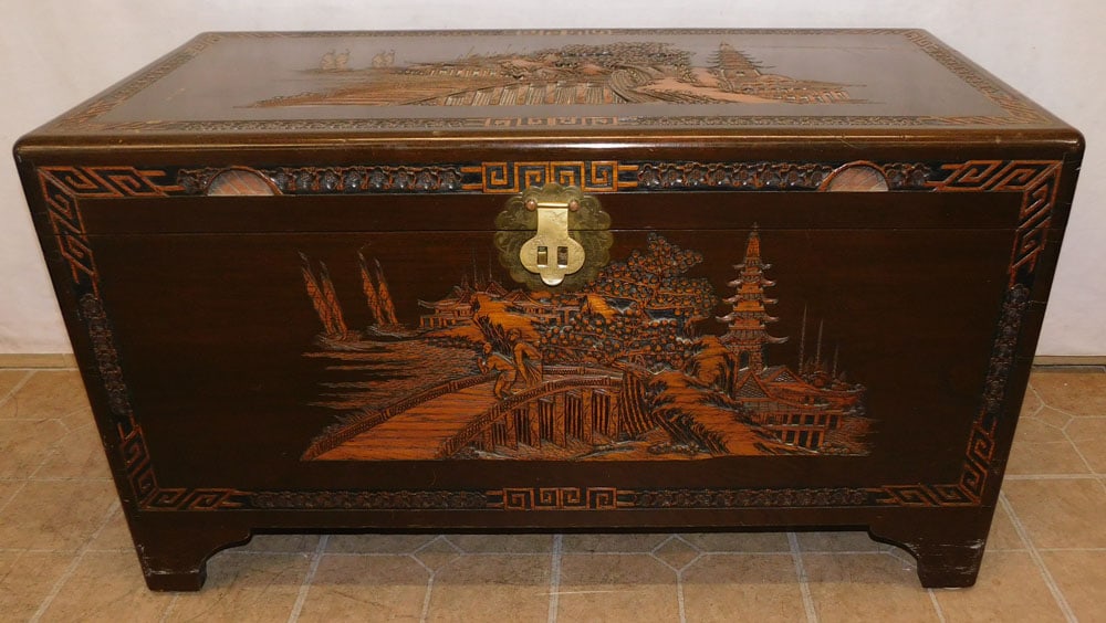 Oriental High Relief Carved Camphor Wood Blanket Chest: Oriental High Relief Carved Camphor Wood Blanket Chest. 39 3/4" W 20" D 22 1/4" H ALL DESCRIPTIONS AND ANY CONDITION STATEMENT GIVEN BY LANGSTON AUCTION GALLERY ARE STRICTLY OPINIONS AND LANGSTON'S SH