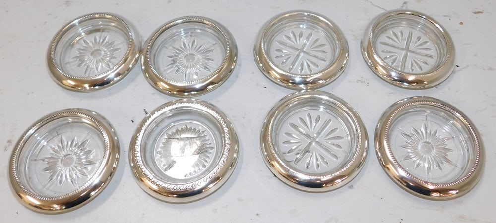 4 Sterling Rimmed Coasters & 4 Silverplate Rimmed Coasters: 4 Sterling Rimmed Coasters & 4 Silverplate Rimmed Coasters. 4" Dia. ALL DESCRIPTIONS AND ANY CONDITION STATEMENT GIVEN BY LANGSTON AUCTION GALLERY ARE STRICTLY OPINIONS AND LANGSTON'S SHALL HAVE NO RE
