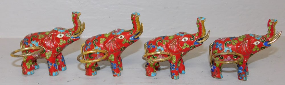 4 Cloisonne Elephant Napkin Rings: 4 Cloisonne Elephant Napkin Rings . 3" H ALL DESCRIPTIONS AND ANY CONDITION STATEMENT GIVEN BY LANGSTON AUCTION GALLERY ARE STRICTLY OPINIONS AND LANGSTON'S SHALL HAVE NO RESPONSIBILITY FOR ERRORS OR 