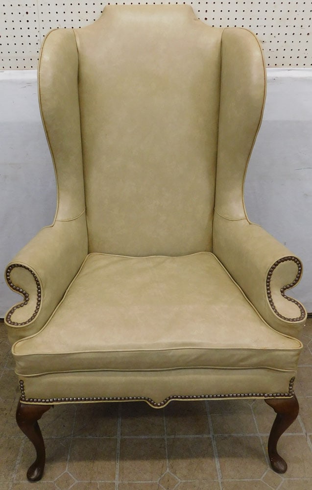 Vinyl Upholstered Wing Back Chair: Vinyl Upholstered Wing Back Chair . 51" H ALL DESCRIPTIONS AND ANY CONDITION STATEMENT GIVEN BY LANGSTON AUCTION GALLERY ARE STRICTLY OPINIONS AND LANGSTON'S SHALL HAVE NO RESPONSIBILITY FOR ERRORS OR