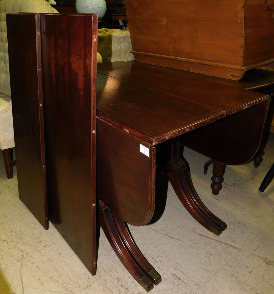 mahogany drop leaf dining table with three leafs: mahogany drop leaf dining table with three leafs. 99 1/4W 42L 9 1/2H "ALL DESCRIPTIONS AND ANY CONDITION STATEMENT GIVEN BY LANGSTON AUCTION GALLERY ARE STRICTLY OPINIONS AND LANGSTON'S SHALL HAVE NO