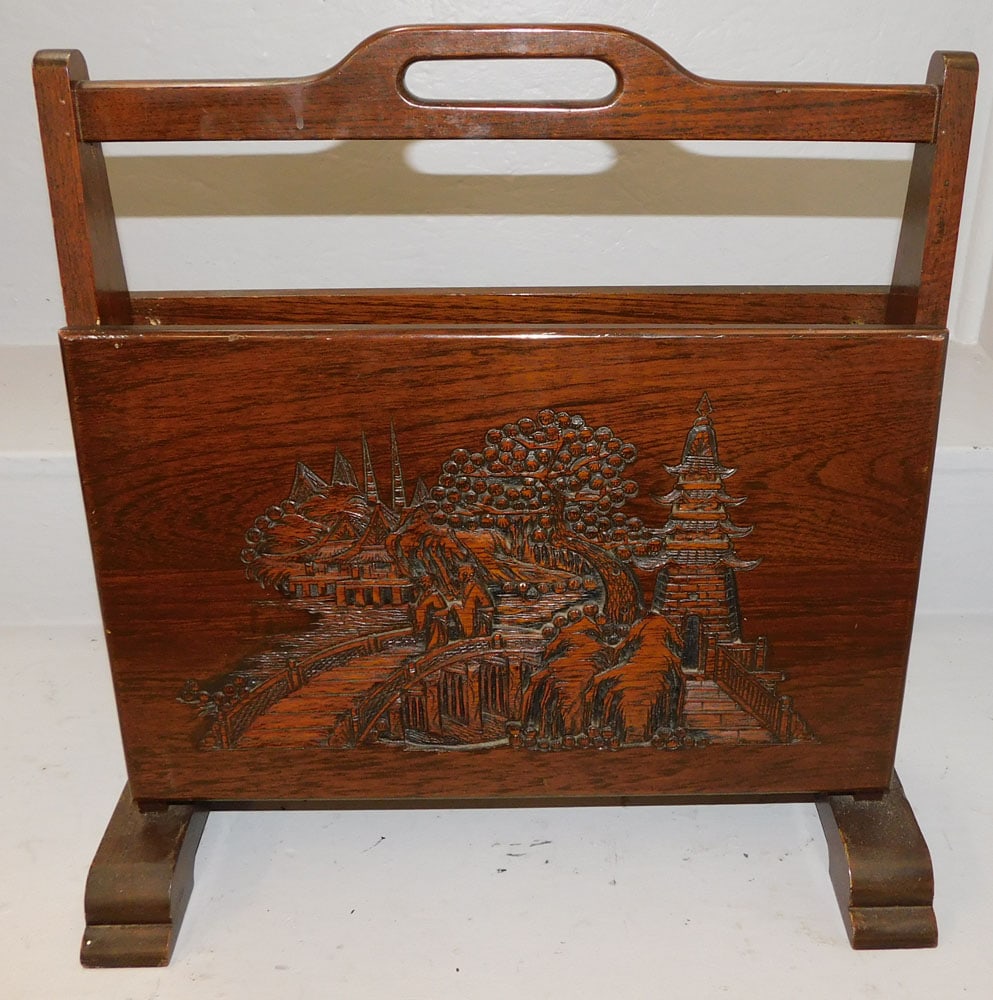 oriental carved teak wood magazine stand: oriental carved teak wood magazine stand. 17 1/2" W 18" H "ALL DESCRIPTIONS AND ANY CONDITION STATEMENT GIVEN BY LANGSTON AUCTION GALLERY ARE STRICTLY OPINIONS AND LANGSTON'S SHALL HAVE NO RESPONSIBIL