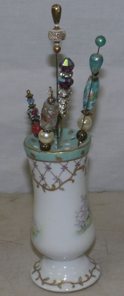 Painted Porcelain Nippon Hat Pin Holder with Pins: Painted Porcelain Nippon Hat Pin Holder with Pins. ALL DESCRIPTIONS AND ANY CONDITION STATEMENT GIVEN BY LANGSTON AUCTION GALLERY ARE STRICTLY OPINIONS AND LANGSTON'S SHALL HAVE NO RESPONSIBILITY FOR
