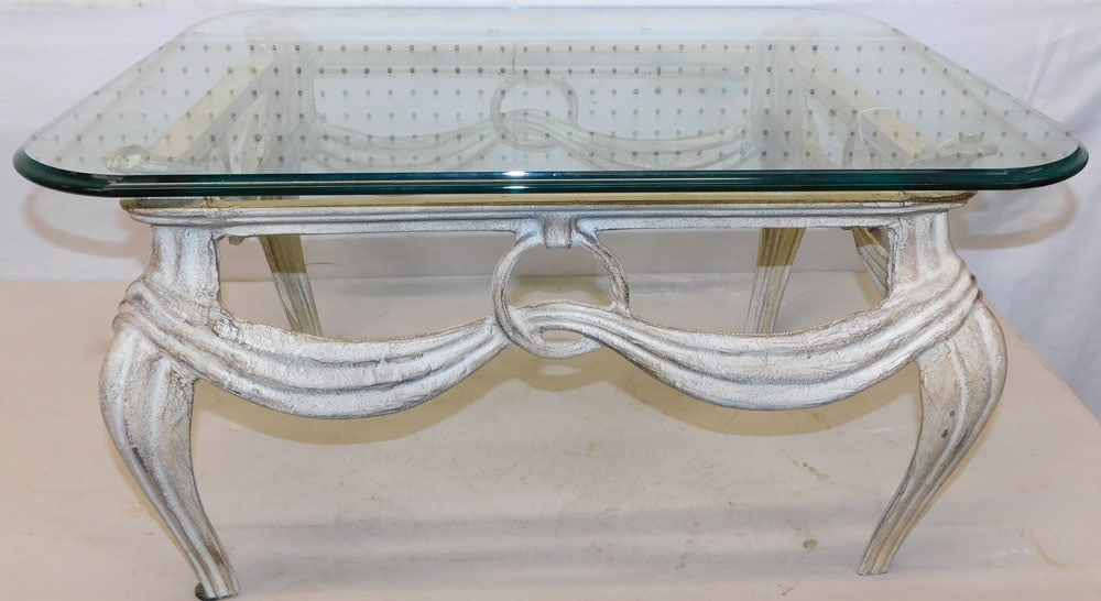 Painted Glass Top Metal Tea Table: Painted Glass Top Metal Tea Table. 28" W 23" D 14 3/4" H ALL DESCRIPTIONS AND ANY CONDITION STATEMENT GIVEN BY LANGSTON AUCTION GALLERY ARE STRICTLY OPINIONS AND LANGSTON'S SHALL HAVE NO RESPONSIBILIT