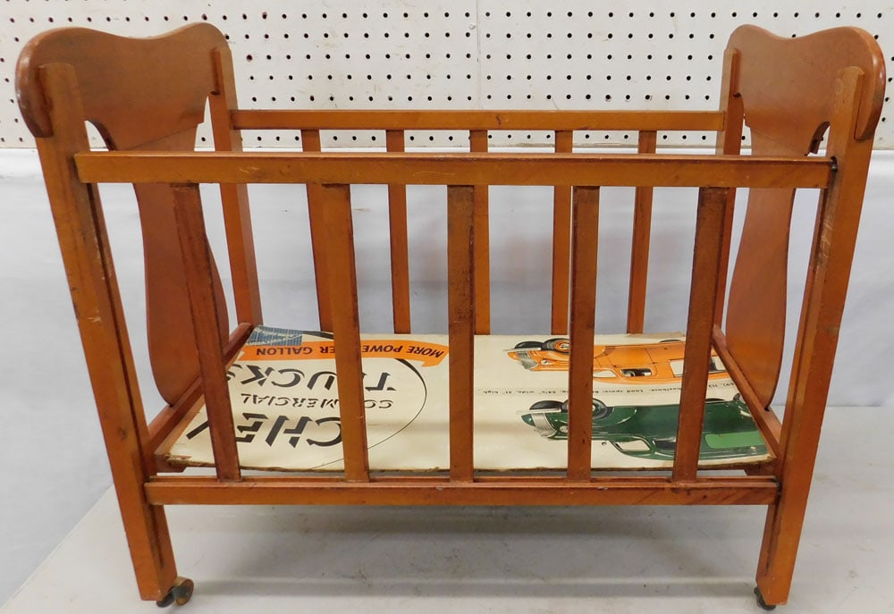 Maple Doll Bed: Maple Doll Bed. 24" W 14" 14" D 1/2" H ALL DESCRIPTIONS AND ANY CONDITION STATEMENT GIVEN BY LANGSTON AUCTION GALLERY ARE STRICTLY OPINIONS AND LANGSTON'S SHALL HAVE NO RESPONSIBILITY FOR ERRORS OR OM