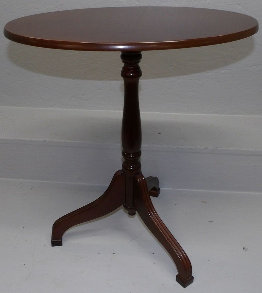 Cherry Tilt Top Oval Candlestand by Bombay: Cherry Tilt Top Oval Candlestand by Bombay. 19" W 14 1/2" D 21 1/4" H ALL DESCRIPTIONS AND ANY CONDITION STATEMENT GIVEN BY LANGSTON AUCTION GALLERY ARE STRICTLY OPINIONS AND LANGSTON'S SHALL HAVE NO 