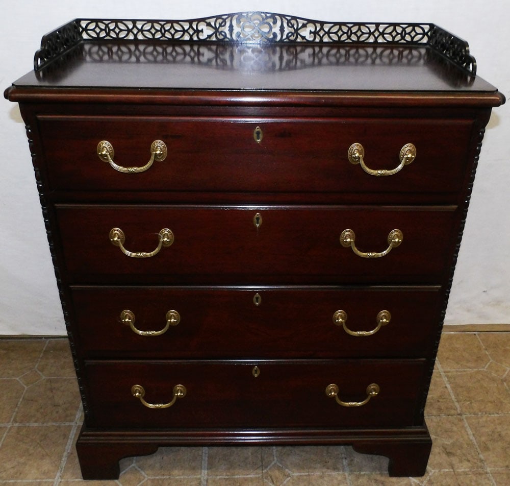 Diminutive Mahogany 4 Drawer Chest with Open Work Gallery by Wellington Hall: Diminutive Mahogany 4 Drawer Chest with Open Work Gallery by Wellington Hall. 28" W 14" D 34" H "ALL DESCRIPTIONS AND ANY CONDITION STATEMENT GIVEN BY LANGSTON AUCTION GALLERY ARE STRICTLY OPINIONS AN