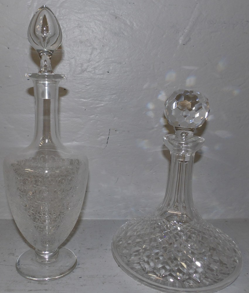 one baccarat decanter and Waterford ship decanter: one baccarat decanter and Waterford ship decanter. Up to 13 3/4" H "ALL DESCRIPTIONS AND ANY CONDITION STATEMENT GIVEN BY LANGSTON AUCTION GALLERY ARE STRICTLY OPINIONS AND LANGSTON'S SHALL HAVE NO RE