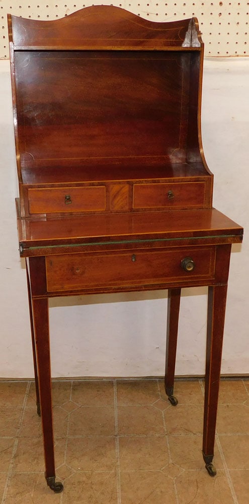19th century mahogany inlaid ladies desk: 19th century mahogany inlaid ladies desk. 20" W 15 1/4" D 47 3/4" H "ALL DESCRIPTIONS AND ANY CONDITION STATEMENT GIVEN BY LANGSTON AUCTION GALLERY ARE STRICTLY OPINIONS AND LANGSTON'S SHALL HAVE NO R