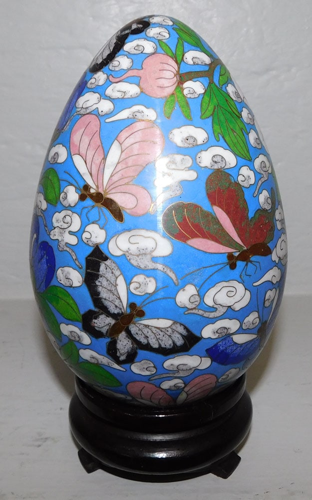 Cloisonne Egg on Wood Stand: Cloisonne Egg on Wood Stand. 7 3/4" H "ALL DESCRIPTIONS AND ANY CONDITION STATEMENT GIVEN BY LANGSTON AUCTION GALLERY ARE STRICTLY OPINIONS AND LANGSTON'S SHALL HAVE NO RESPONSIBILITY FOR ERRORS OR OM