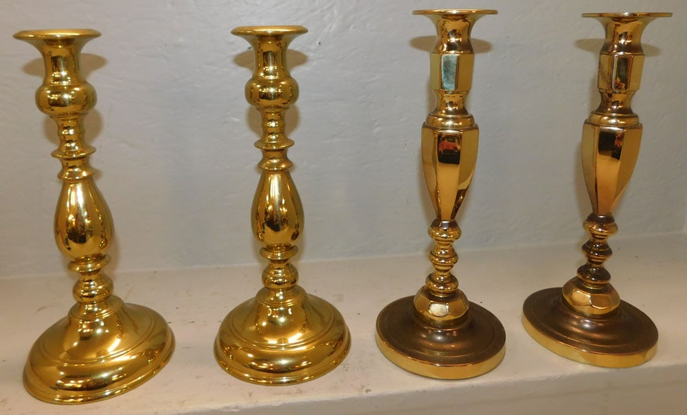 one pair Baldwin and one pair Virginia metalcrafters brass candle sticks (1 of 4)