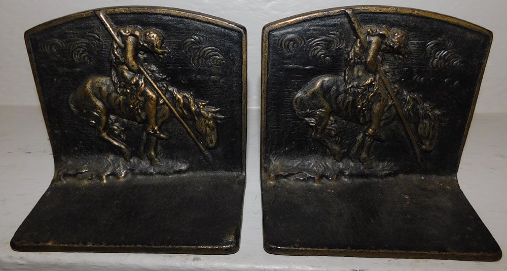 painted cast iron" end of trail" native American book ends: painted cast iron" end of trail" native American book ends . 5 1/2" W 3" D 5" H "ALL DESCRIPTIONS AND ANY CONDITION STATEMENT GIVEN BY LANGSTON AUCTION GALLERY ARE STRICTLY OPINIONS AND LANGSTON'S SHA