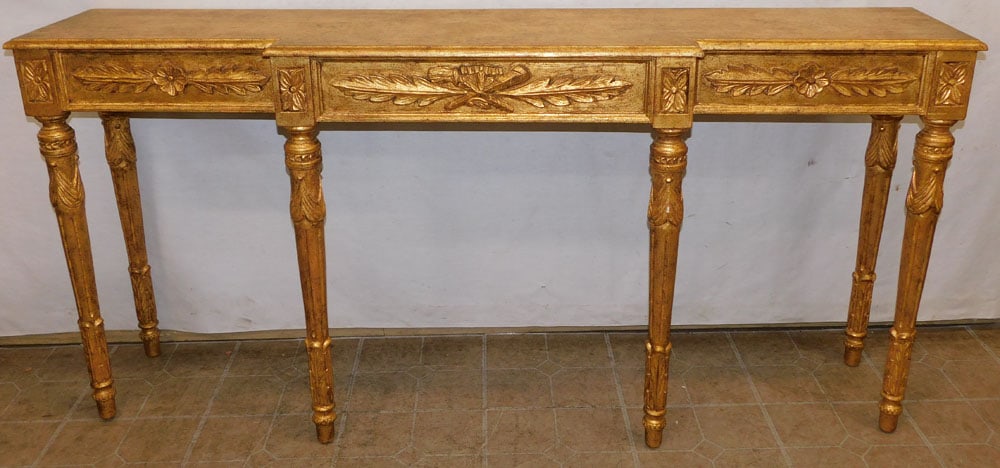 gilded firewood console: gilded firewood console . 69 1/4" W 15 1/2" D 33" H "ALL DESCRIPTIONS AND ANY CONDITION STATEMENT GIVEN BY LANGSTON AUCTION GALLERY ARE STRICTLY OPINIONS AND LANGSTON'S SHALL HAVE NO RESPONSIBILITY FO