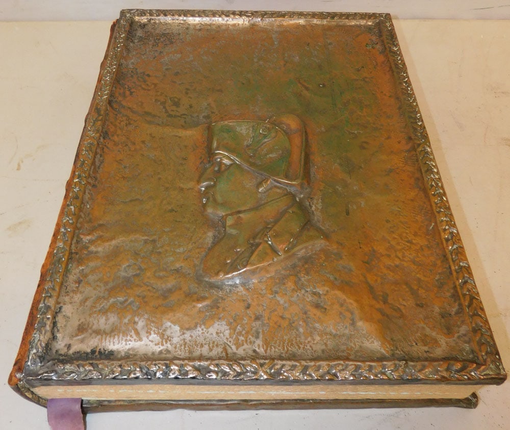 Napoleon Copper & Leather Bound Book: Napoleon Copper & Leather Bound Book. 13 1/4" x 17" "ALL DESCRIPTIONS AND ANY CONDITION STATEMENT GIVEN BY LANGSTON AUCTION GALLERY ARE STRICTLY OPINIONS AND LANGSTON'S SHALL HAVE NO RESPONSIBILITY FO