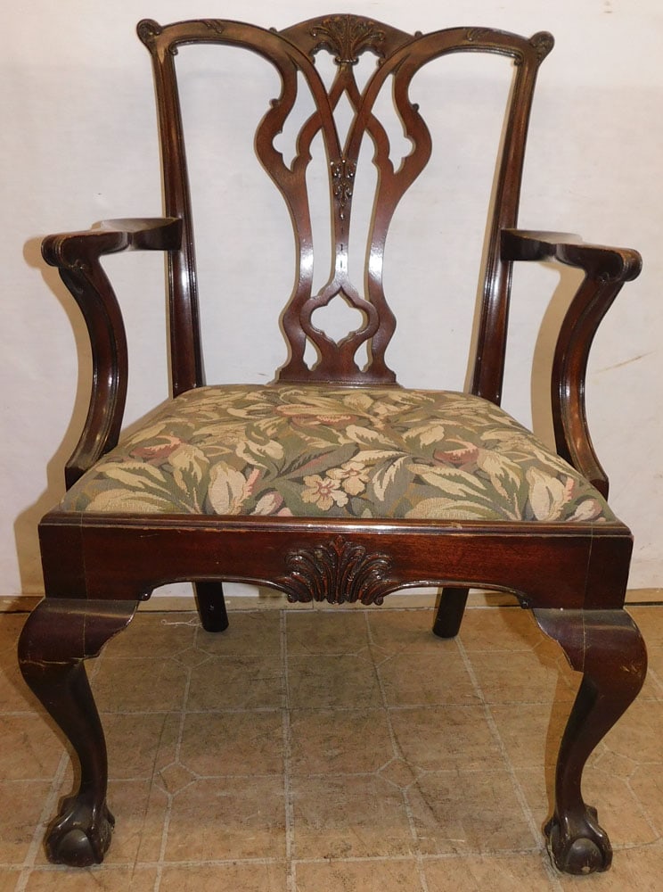 Carved Mahogany Arm Chair with Ball & Claw Feet: Carved Mahogany Arm Chair with Ball & Claw Feet . 38" H "ALL DESCRIPTIONS AND ANY CONDITION STATEMENT GIVEN BY LANGSTON AUCTION GALLERY ARE STRICTLY OPINIONS AND LANGSTON'S SHALL HAVE NO RESPONSIBILIT