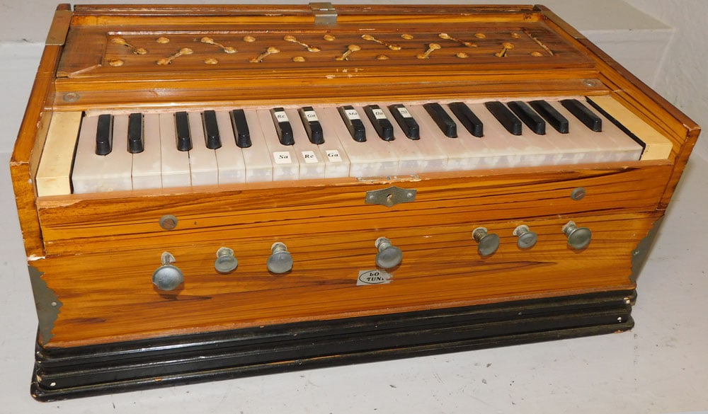 Mohan Music House Accordion: Mohan Music House Accordion. 23" W 11 1/2" D 9 1/2" H"ALL DESCRIPTIONS AND ANY CONDITION STATEMENT GIVEN BY LANGSTON AUCTION GALLERY ARE STRICTLY OPINIONS AND LANGSTON'S SHALL HAVE NO RESPONSIBILITY F