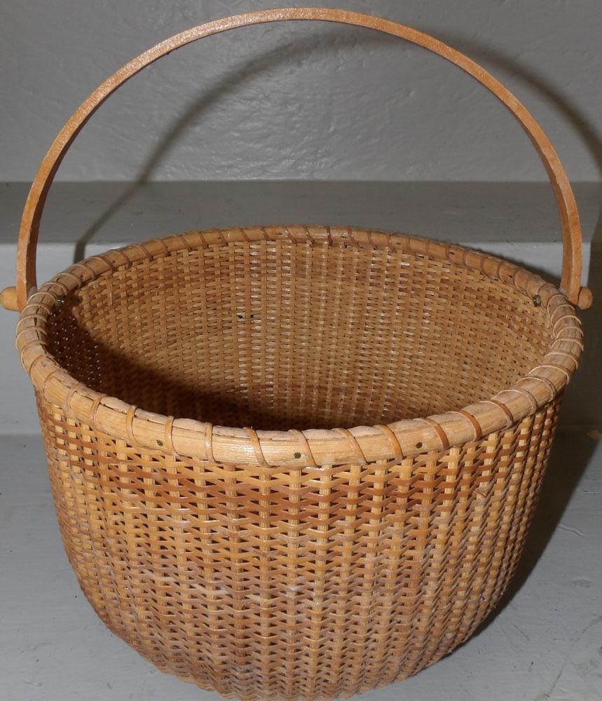 Nantucket Basket: Nantucket Basket. 11 1/2" Dia. 7 1/4" H"ALL DESCRIPTIONS AND ANY CONDITION STATEMENT GIVEN BY LANGSTON AUCTION GALLERY ARE STRICTLY OPINIONS AND LANGSTON'S SHALL HAVE NO RESPONSIBILITY FOR ERRORS OR O