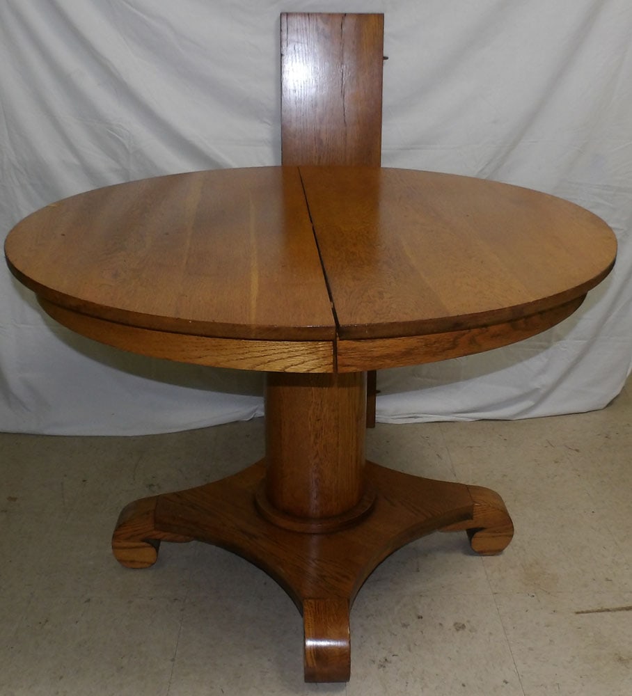 antique round oak dining table with one leaf (1 of 2)