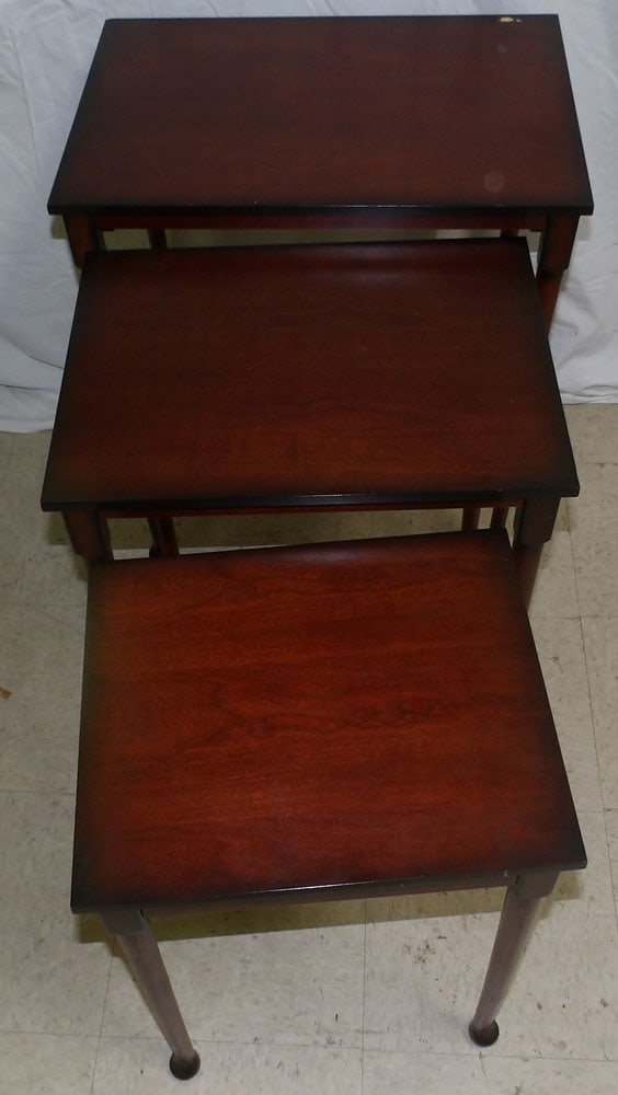 mahogany nesting tables by bombay: mahogany nesting tables by bombay. 23" W 16" D 25 3/4" H"ALL DESCRIPTIONS AND ANY CONDITION STATEMENT GIVEN BY LANGSTON AUCTION GALLERY ARE STRICTLY OPINIONS AND LANGSTON'S SHALL HAVE NO RESPONSIBILIT