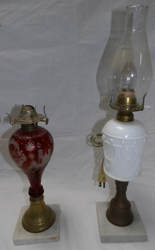 2 antique oil lamps: 2 antique oil lamps. Up to 19 1/2" H"ALL DESCRIPTIONS AND ANY CONDITION STATEMENT GIVEN BY LANGSTON AUCTION GALLERY ARE STRICTLY OPINIONS AND LANGSTON'S SHALL HAVE NO RESPONSIBILITY FOR ERRORS OR OMIS