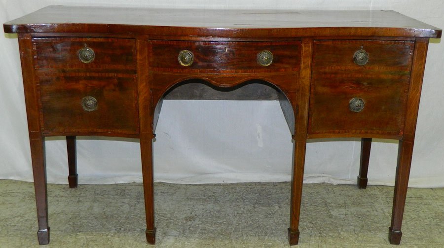 Period 18th c HW mah. Serp. front sideboard: Period 18th century Hepplewhite mahogany serpentine front side board with 2 cellaret drawers 63" wide x 27 3/8" deep x 36" tall. .