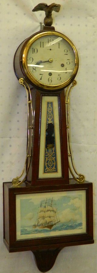 New Haven eight day banjo clock.: New Haven eight day banjo clock. 32" tall.