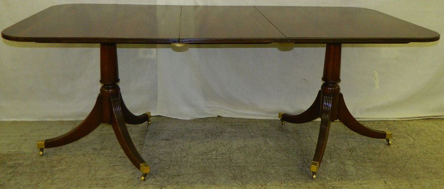 2 pedestal mahogany dining table with 1 leaf.: Two pedestal mahogany dining table with 1 leaf. 77" wie x 36" deep x 29 1/4" tall.