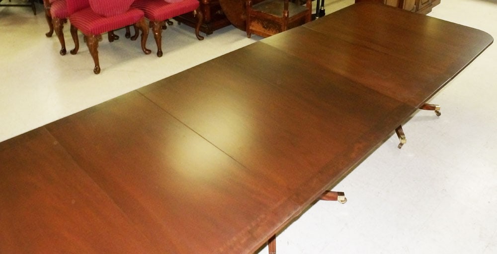 Mahogany Banded Top 3 Pedestal Dining Table with 2 Leaves: Mahogany Banded Top 3 Pedestal Dining Table with 2 Leaves. 144" L 45" D 28 1/2" H ALL DESCRIPTIONS AND ANY CONDITION STATEMENT GIVEN BY LANGSTON AUCTION GALLERY ARE STRICTLY OPINIONS AND LANGSTON'S SH