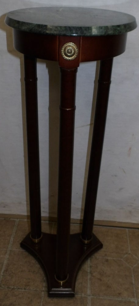 Mahogany Marble Top Plant Stand by Bombay: Mahogany Marble Top Plant Stand by Bombay. 11 Dia. 32 1/4" H ALL DESCRIPTIONS AND ANY CONDITION STATEMENT GIVEN BY LANGSTON AUCTION GALLERY ARE STRICTLY OPINIONS AND LANGSTON'S SHALL HAVE NO RESPONSIB