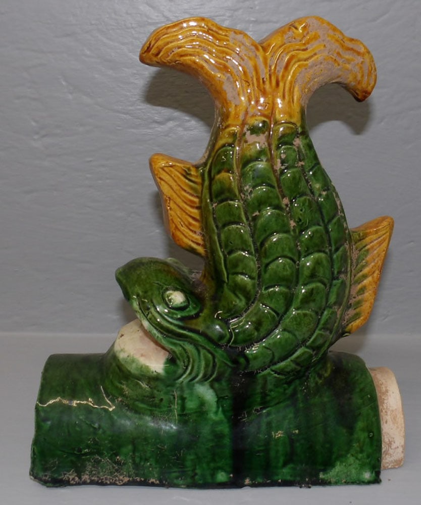 Chinese Pottery Dolphin Roof Tile: Chinese Pottery Dolphin Roof Tile . 10" H ALL DESCRIPTIONS AND ANY CONDITION STATEMENT GIVEN BY LANGSTON AUCTION GALLERY ARE STRICTLY OPINIONS AND LANGSTON'S SHALL HAVE NO RESPONSIBILITY FOR ERRORS OR
