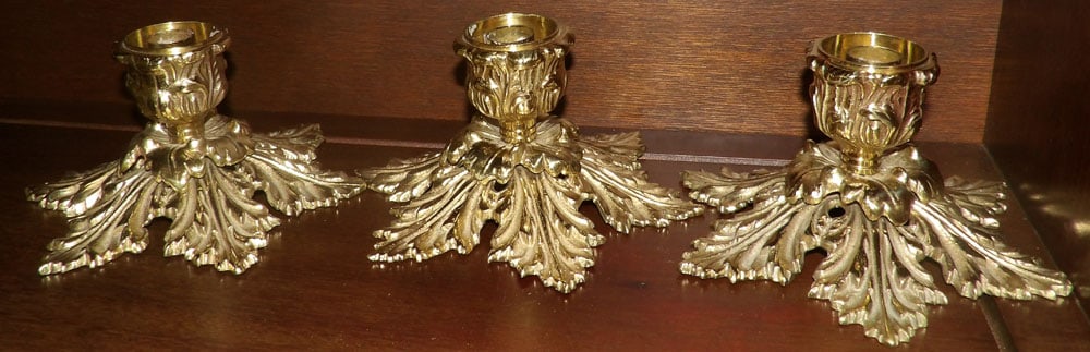 3 Ornate Cast Brass Candlesticks by Harvin: 3 Ornate Cast Brass Candlesticks by Harvin. 3 1/2" H ALL DESCRIPTIONS AND ANY CONDITION STATEMENT GIVEN BY LANGSTON AUCTION GALLERY ARE STRICTLY OPINIONS AND LANGSTON'S SHALL HAVE NO RESPONSIBILITY FO