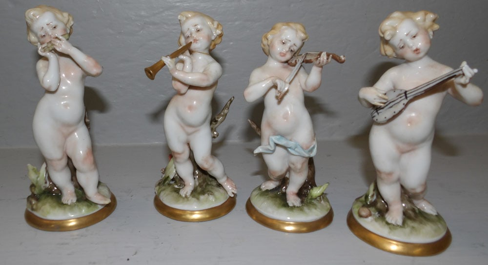 4 Capodimonte Musician Cherubs: 4 Capodimonte Musician Cherubs. Up to 5 3/4" H ALL DESCRIPTIONS AND ANY CONDITION STATEMENT GIVEN BY LANGSTON AUCTION GALLERY ARE STRICTLY OPINIONS AND LANGSTON'S SHALL HAVE NO RESPONSIBILITY FOR ERRO