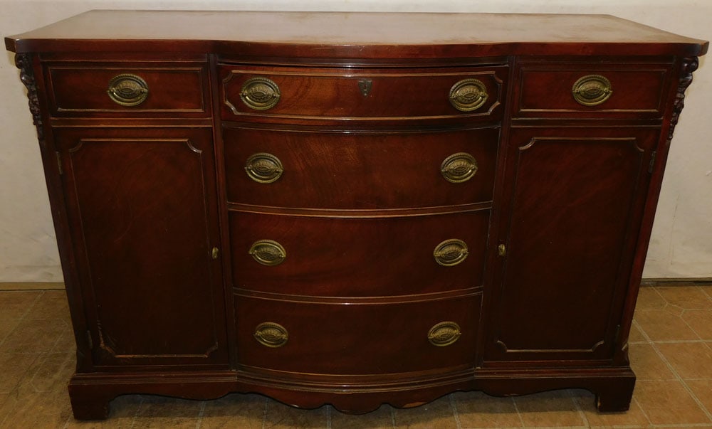 Mahogany Bow Front Sideboard: Mahogany Bow Front Sideboard. 52" W 20" D 35" H ALL DESCRIPTIONS AND ANY CONDITION STATEMENT GIVEN BY LANGSTON AUCTION GALLERY ARE STRICTLY OPINIONS AND LANGSTON'S SHALL HAVE NO RESPONSIBILITY FOR ERR